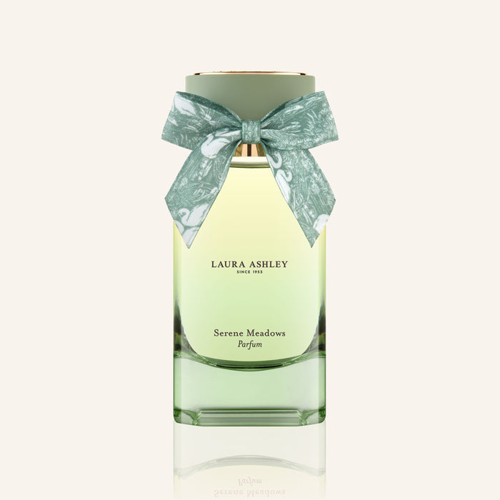Laura Ashley Serene Meadows perfume bottle with a bow on a white background